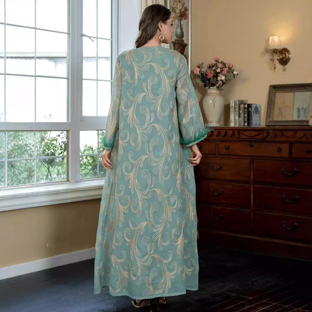 Turquoise Premium Arabian Craft Sheer Modest Gown Light Airflow Semi-Sheer Textile All Over Delicate Pale Gold Thread Embroidery Classic V-Neckline Loose Full-Length Silhouette Voluminous Bell Sleeves Pan-Arab Ladies Attire For Elegant Evening Gather
