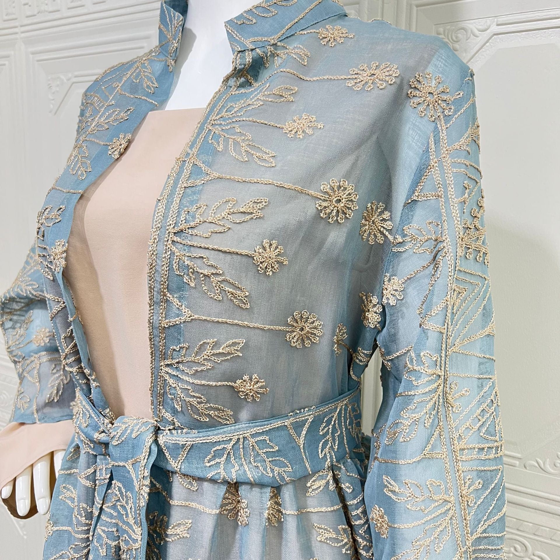 Arabian Pastel Boutique Designer Modest Layered Attire Soft Muted Sky Lightweight Transparent Mesh All Over Vintage Leaf Daisy Thread Motif Mini Stand Neck Self-Tie Waist Belt Double Flared Bell Cuff Sleeves Semi-Sheer Open Front Full Length Outer Ro