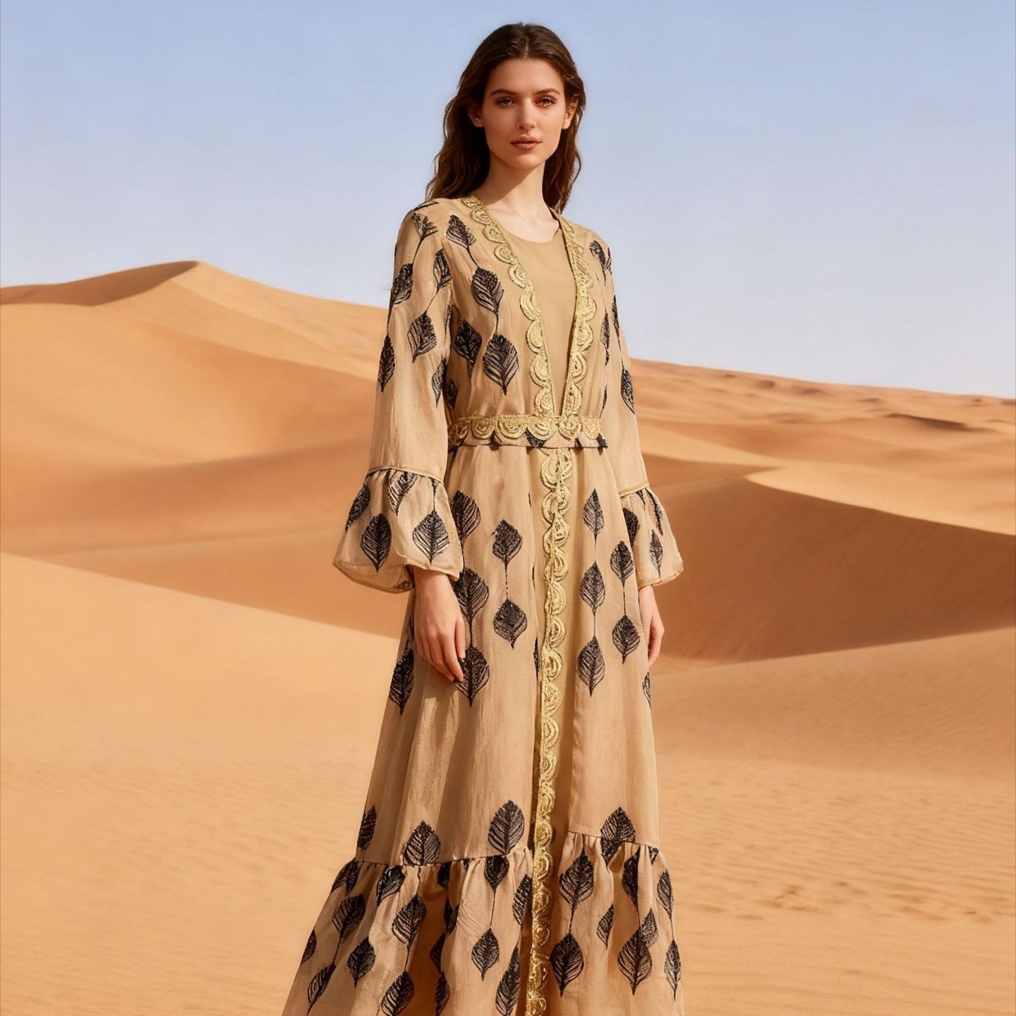 Desert FYP Viral Khaleeji Two-Piece Modest Co-ord Warm Sand Tone Light Woven Outer Kaftan Matching Solid Slip Dress All Over Vintage Black Leaf Print Handcrafted Golden Lace Trim Placket Elastic Gold Waist Belt Bell Flared Tiered Long Sleeve Ruffled