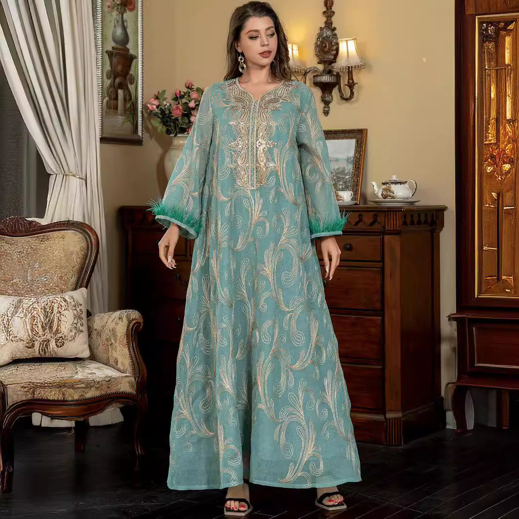 Turquoise Premium Arabian Craft Sheer Modest Gown Light Airflow Semi-Sheer Textile All Over Delicate Pale Gold Thread Embroidery Classic V-Neckline Loose Full-Length Silhouette Voluminous Bell Sleeves Pan-Arab Ladies Attire For Elegant Evening Gather