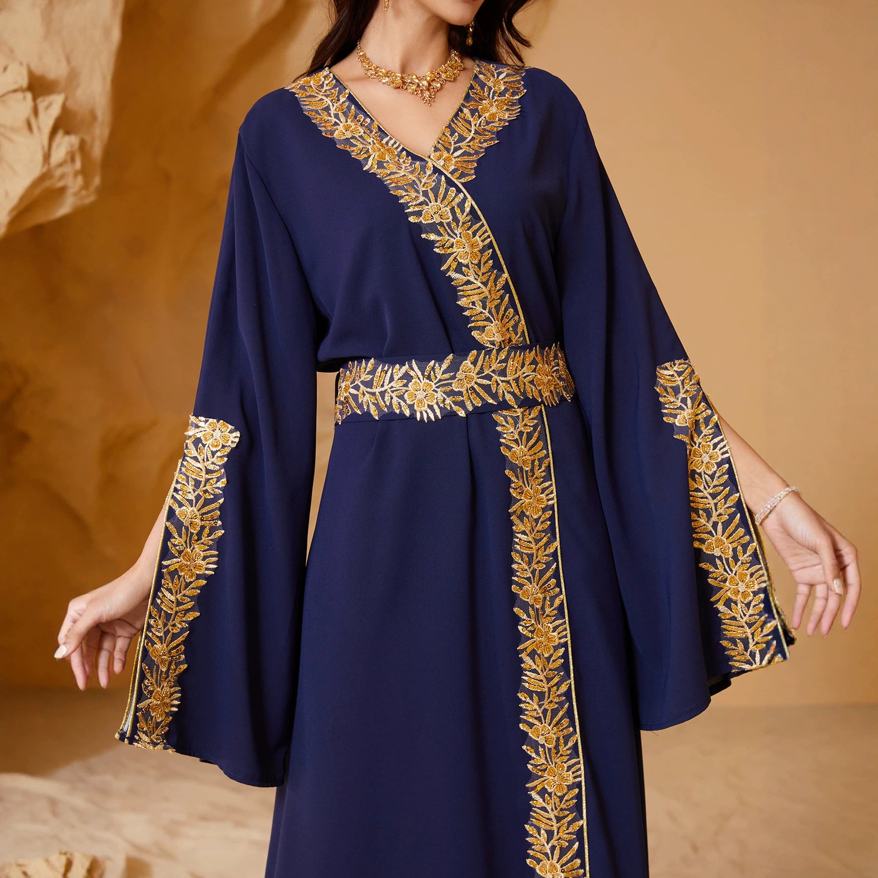 Smooth Crepe Wrap V Neck Continuous Hand Stitched Golden Foliage Border Embroidery Self-Fabric Cinch Belt Oversized Flared Bell Cuffs Floor-Sweeping A-Line Plus Inclusive Silhouette Qatari Omani Kuwaiti Ladies Modest Kaftan For Walima Wedding Gala If