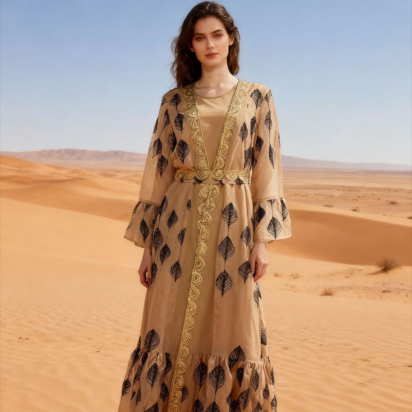 Desert FYP Viral Khaleeji Two-Piece Modest Co-ord Warm Sand Tone Light Woven Outer Kaftan Matching Solid Slip Dress All Over Vintage Black Leaf Print Handcrafted Golden Lace Trim Placket Elastic Gold Waist Belt Bell Flared Tiered Long Sleeve Ruffled