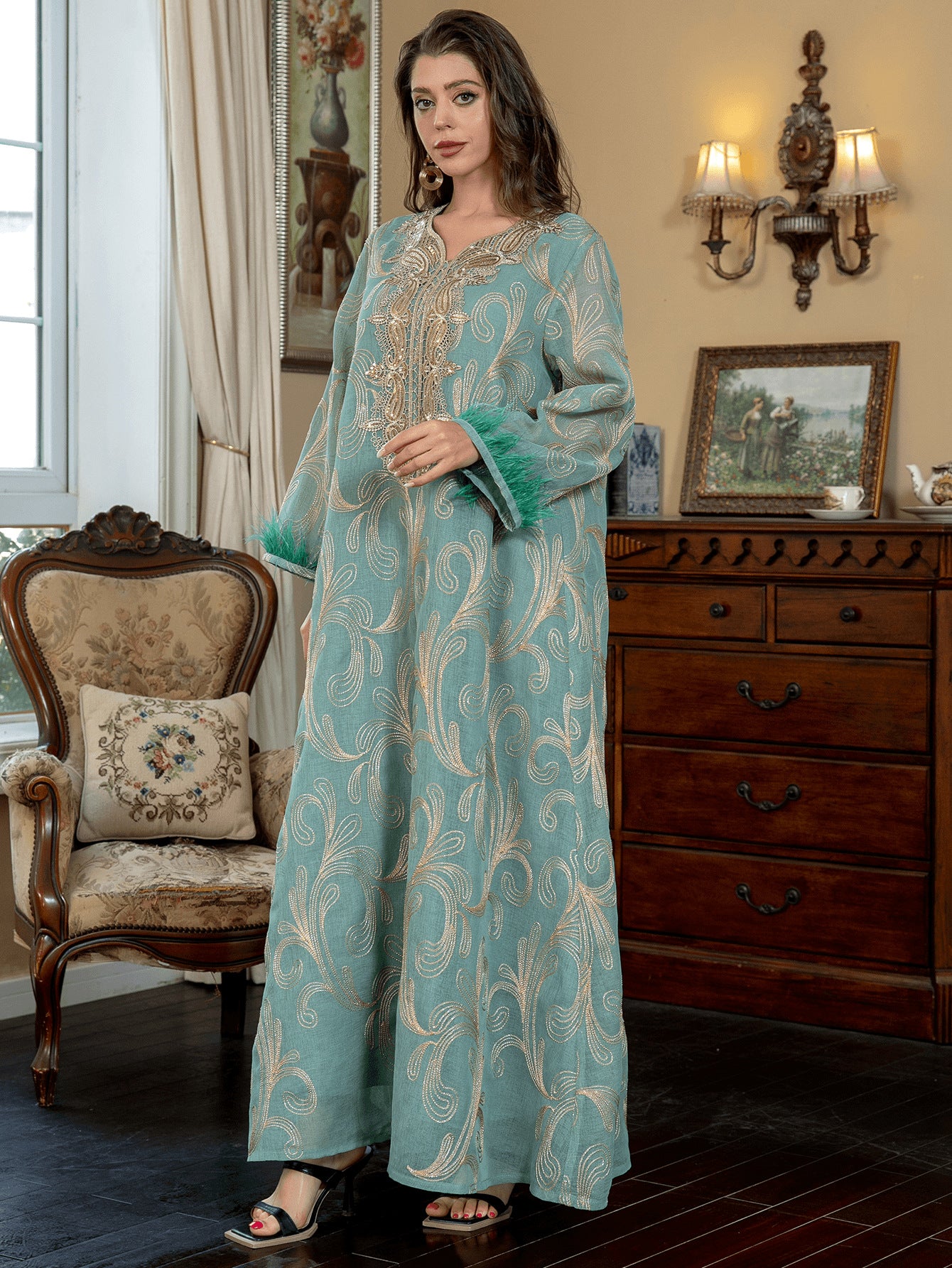 Turquoise Premium Arabian Craft Sheer Modest Gown Light Airflow Semi-Sheer Textile All Over Delicate Pale Gold Thread Embroidery Classic V-Neckline Loose Full-Length Silhouette Voluminous Bell Sleeves Pan-Arab Ladies Attire For Elegant Evening Gather