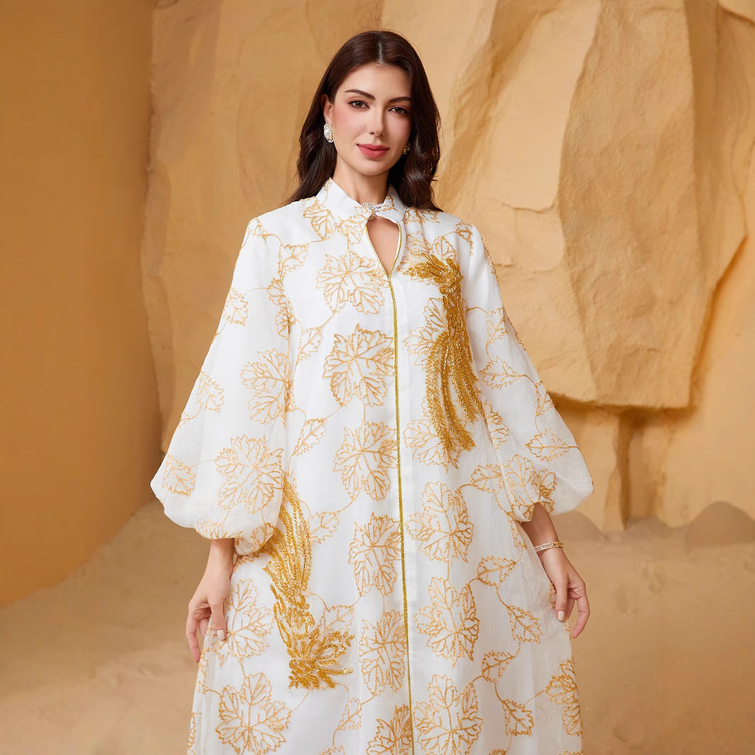 Viral Instagram UAE Dubai Stand Collar Abaya Off White All Over Golden Leaf Jacquard Print Hollow Placket Vertical Golden Tassel Sequins Embroidery Puff Bubble Long Sleeve Floor Length Plus Size GCC Women Modest Maxi Robe For Saudi Ramadan Tarawih OO