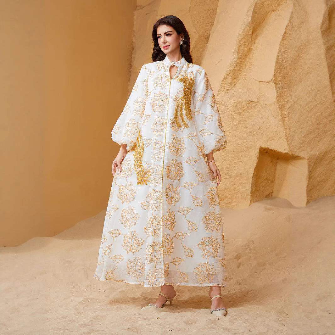 Viral Instagram UAE Dubai Stand Collar Abaya Off White All Over Golden Leaf Jacquard Print Hollow Placket Vertical Golden Tassel Sequins Embroidery Puff Bubble Long Sleeve Floor Length Plus Size GCC Women Modest Maxi Robe For Saudi Ramadan Tarawih OO